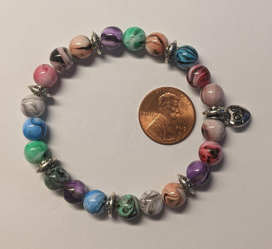 Bracelets - stacker bracelets made with 8-mm multi-colored ink patterned beads, spacer beads, a charm, and durable stretch cord.
